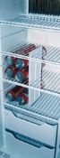 A divider can help to keep soda cans organized in a motorhome refrigerator