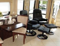 Euro-styled recliners from Villa adorn the living room seating area in the Astoria 41KT motorhome.