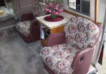 The barrel chairs were reupholstered with matching fabric and leather.
