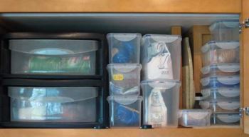 Plastic containers can help to organize the contents of cabinets in a motorhome.
