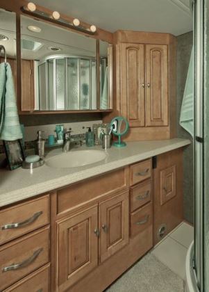 The rear master bathroom is one of two bath areas in the Winnebago Journey 42E motorhome.