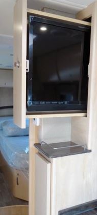 The LED TV slides out for viewing by cockpit and dinette occupants.