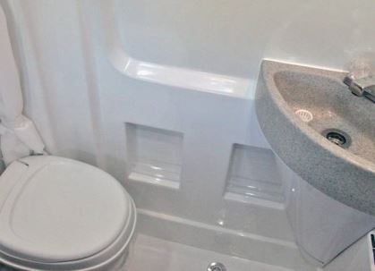 The motorhome's permanent wet bath is created with formed composite material.