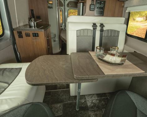 The Travato provides comfortable living accommodations, with touches such as a double-tiered, adjustable dinette table.