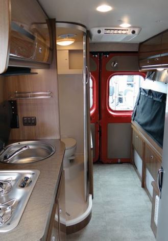 A rearward glance inside the Travato reveals the curbside galley and wet bath.