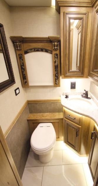 The Cornerstone 45A contains a midcoach half bath equipped with a macerator toilet.