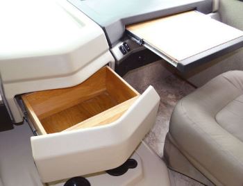The cockpit also contains center drawer storage and a slideout workstation for the copilot.