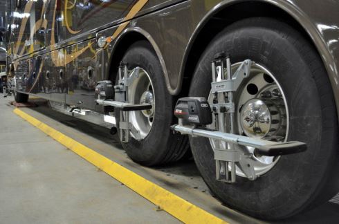 Alignment sensors are placed on the drive axle and tag axle to verify that thrus angles meet specifications.