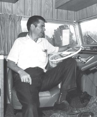 In this 1970 photo, C.M. Fore relaxes in a Foretravel coach.