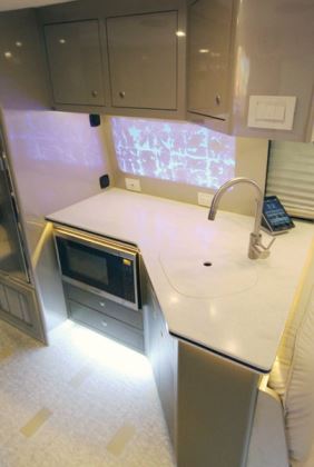 The new galley has custom cabinets and a microwave-convention oven.