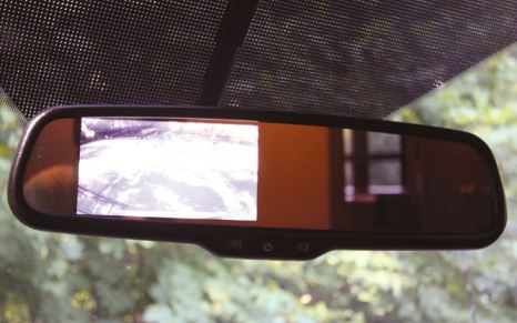 A rearview mirror incorporates a backup camera monitor.