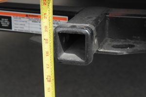 At the lowest setting, the distance from the ground to the bottom of the hitch was 18 inches.