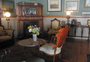 Antique furnishings fill this sitting room in the Occidental Hotel.