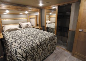 The bedroom in the Vilano 320GK beckons with ample storage, lighting, and a memory-foam mattress .