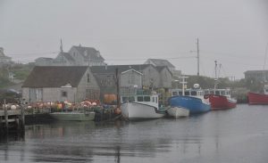 Fog envelops Peggy’s Cove, an idyllic fishing village near Halifax, Nova Scotia, as captured by David Carlson.