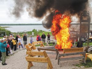 A fish boil dramatically concludes in front of sight-seers outside Rowleys Bay Restaurant in Ellison Bay.