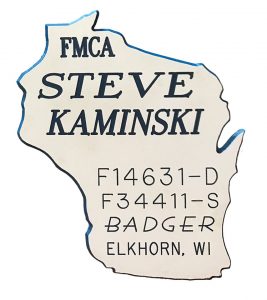 The Kaminskis' Badger chapter badges reflect that they are second-generation FMCA members.