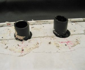 Holding tank vent pipes should protrude from the roof surface after vent caps are removed.