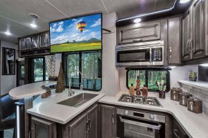 The Cyclone 4270 features a generously sized galley with stainless-steel appliances and, for a contemporary look, an adjacent rounded dinette.