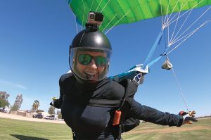 FMCA member Annette O'Neil flashes a smile after landing at Skydive Arizona in May 2018.