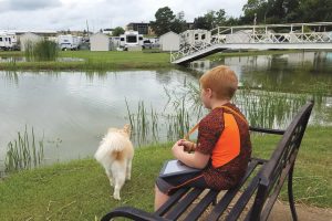 Campground amenities at the Antique Capital RV Park in Gladewater, Texas, include an on-site store, activity center, and catch-and-release fishing pond.