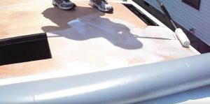 Apply adhesive and follow manufacturer instructions for set-up time. Next, roll the rubber membrane over it, taking care not to allow large bubbles or creases.