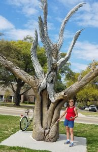 Ray and Margie Hauser discover a carved tree, one of many they saw during an RV trip to Biloxi, Mississippi. 