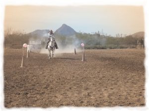 A mounted shooter runs the pistol course during a Cowboy Action Shooting event at Winter Range in Phoenix, Arizona.