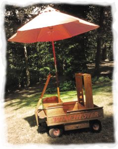 Bruce and Deborah Murphy tote weapons, ammunition, and assorted supplies in their gun cart, which resembles a miniature Winchester delivery buckboard.