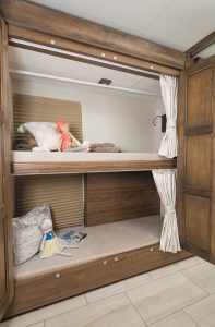 The Sportscoach 409BG contains a curbside bunk area, which can be used as wardrobe space if the beds are not needed. 