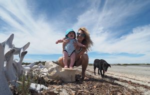 Jennifer poses Tucker atop one of the many whale bones that dot the beach at San Ignacio Lagoon, where whale-watching is popular.