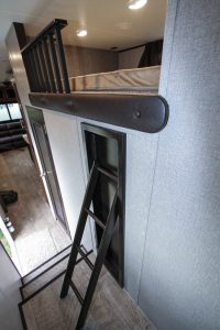Above the central bunk room in the Jayco Eagle, a loft area can be used for storage or sleeping.