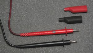 Screw-on alligator clips are a handy accessory for multimeter probes. The clips firmly grip wiring or contacts and allow for hands-free readings.