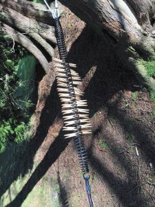 After the stretching process, clothespins are then inserted into the spring coils.