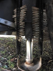 Once the jack is fully extended with the jack foot centered under the piston, the clothespins can be removed.