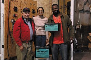 FMCA national president Jon Walker poses with Avanti Lalwani, director of marketing at Briter Products (center) and Gyasi Mwewe, director of engineering.