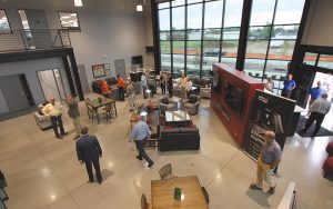 A view of the Newmar service center customer lobby from the mezzanine. Kitchen and laundry facilities, a pet lounge, Wi-Fi access, and more make customers comfortable.