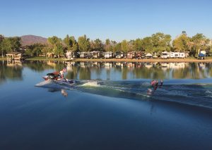 During a skiing competition, RVers park on the waterfront at Wet Set Village, the private lake near Newberry Springs, California, that was developed by Frank and a few others.