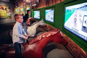 The Kentucky Derby Museum’s “Riders Up” exhibit offers an experience similar to that of jockeys.