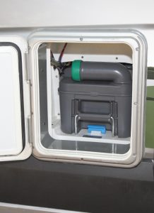 A removable five-gallon cassette toilet, accessible from an exterior compartment, eliminates the need for a black-water tank. 