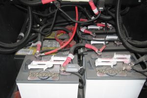 Four 6-volt batteries that are wired in a series/parallel configuration, as shown here, provide more current capacity than two 12-volt batteries.