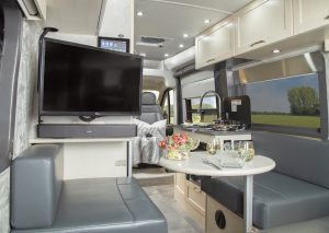 A view of the Pleasure-Way Lexor FL motorhome looking forward from the rear lounge 