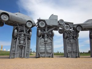 At Carhenge in Alliance, Nebraska, a 1951 Willys Jeep rests atop 1960s sedans 