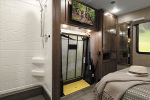 In the gas-powered Intent 30 AE, the wheelchair lift is situated in the rear bedroom, on the curbside wall. 