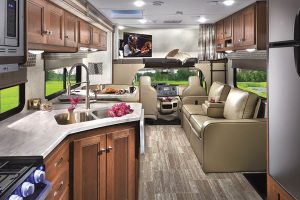 The Forest River Sunseeker 3050S floor plan features wood-look vinyl flooring throughout, contemporary residential-style cabinetry and décor, and plenty of creature comforts. Full-body paint options include the Topaz scheme shown below.