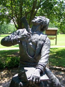 A statue depicting Sequoyah looking heavenward is outside the Oklahoma cabin he built in 1829.