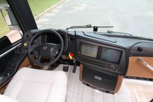 The center of the cockpit holds a large entertainment and navigation system, as well as a monitor for the rear and side cameras.