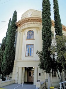 The 1914 high school is set on a hillside with ground-level entrances on all four floors.