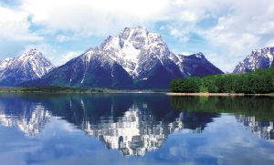 Steve Munnell spotlighted the magnificence of the Teton Mountains while aboard a tour boat on Wyoming’s Jackson Lake.