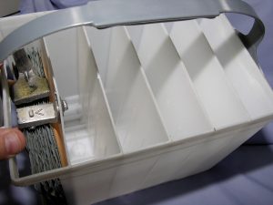 The plastic case of a typical 12-volt battery has six cells with an insulating separator between each plate.